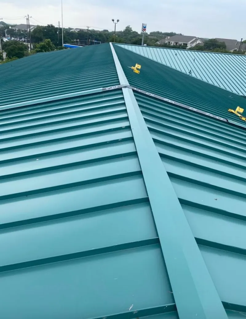 Green commercial metal roof ridge and valley for Metal Roof Repair in Cypress